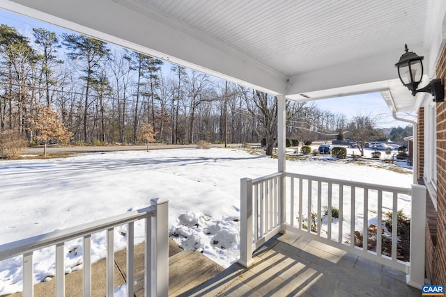 view of snow covered deck