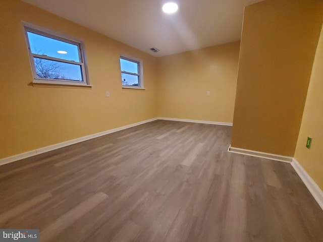 empty room featuring wood-type flooring