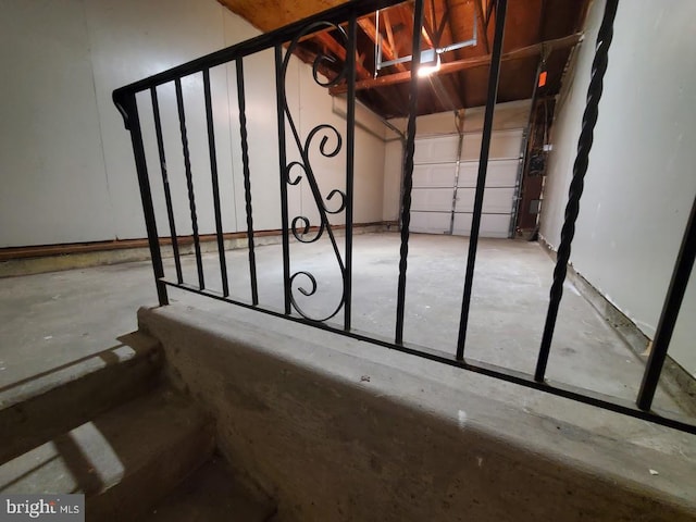 stairway featuring concrete floors