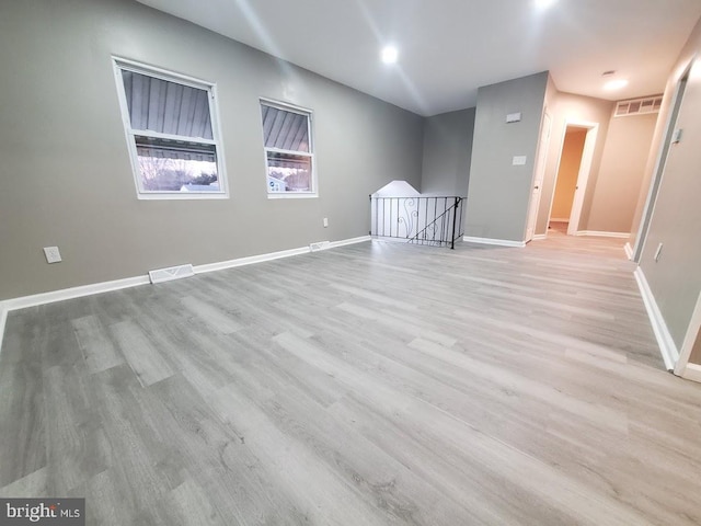 unfurnished room with light hardwood / wood-style flooring