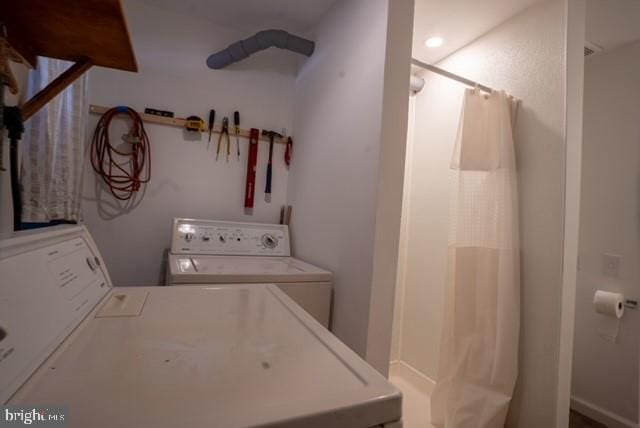 laundry room featuring washer and clothes dryer