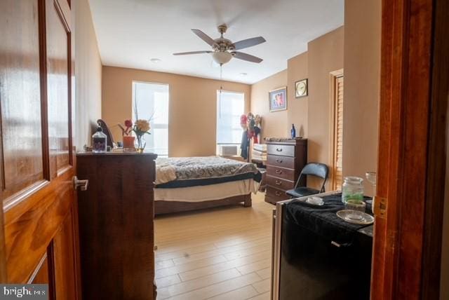 bedroom featuring ceiling fan and light wood-type flooring