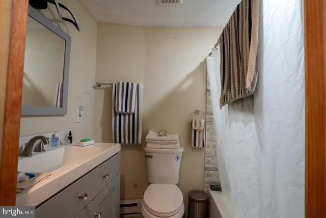 bathroom featuring toilet, vanity, a baseboard heating unit, and a shower with shower curtain