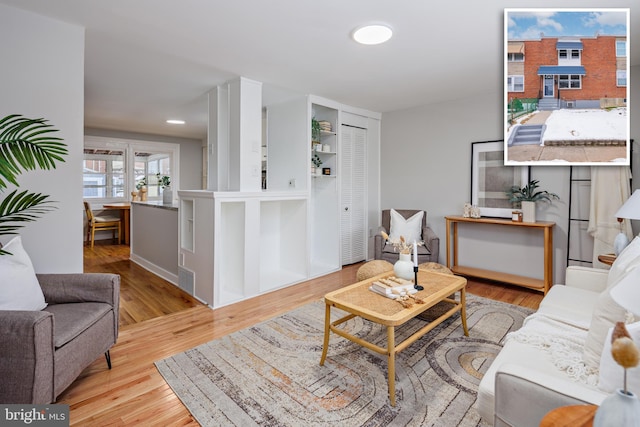 living room with light hardwood / wood-style flooring