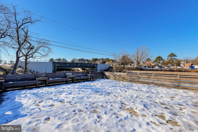 view of yard layered in snow