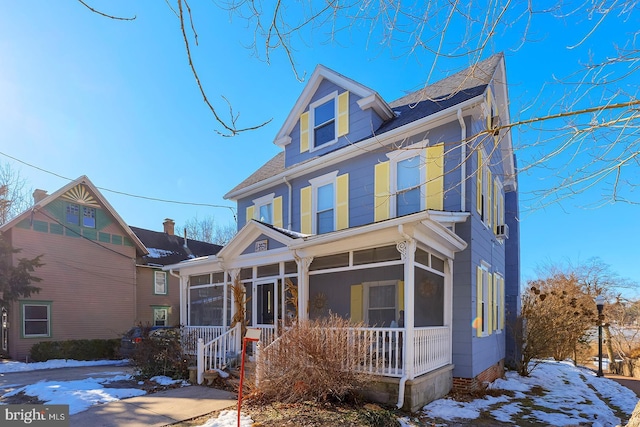 view of front facade featuring a sunroom