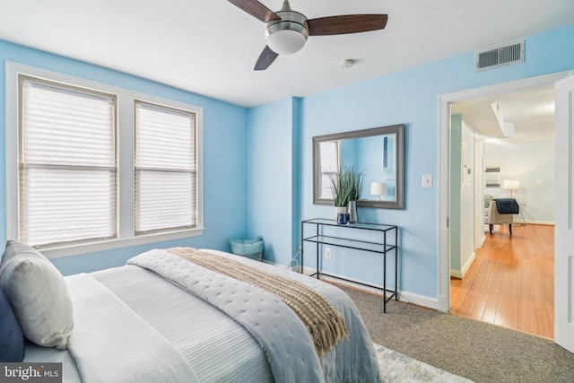 bedroom with ceiling fan and carpet floors