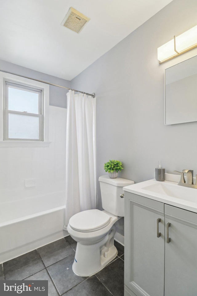 full bathroom with toilet, vanity, shower / bath combo, and tile patterned flooring