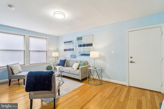 living room with light hardwood / wood-style flooring