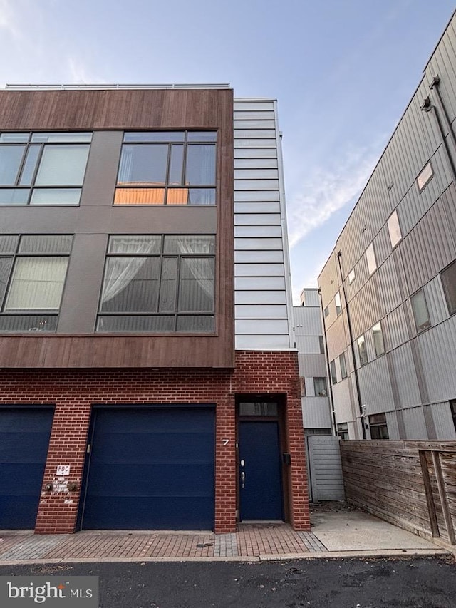 view of building exterior featuring a garage