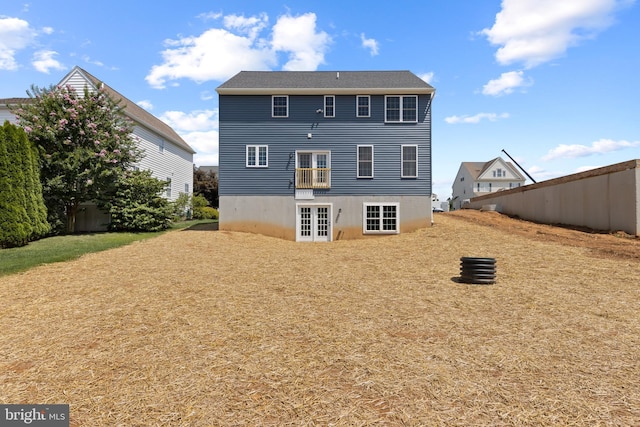 rear view of property with french doors