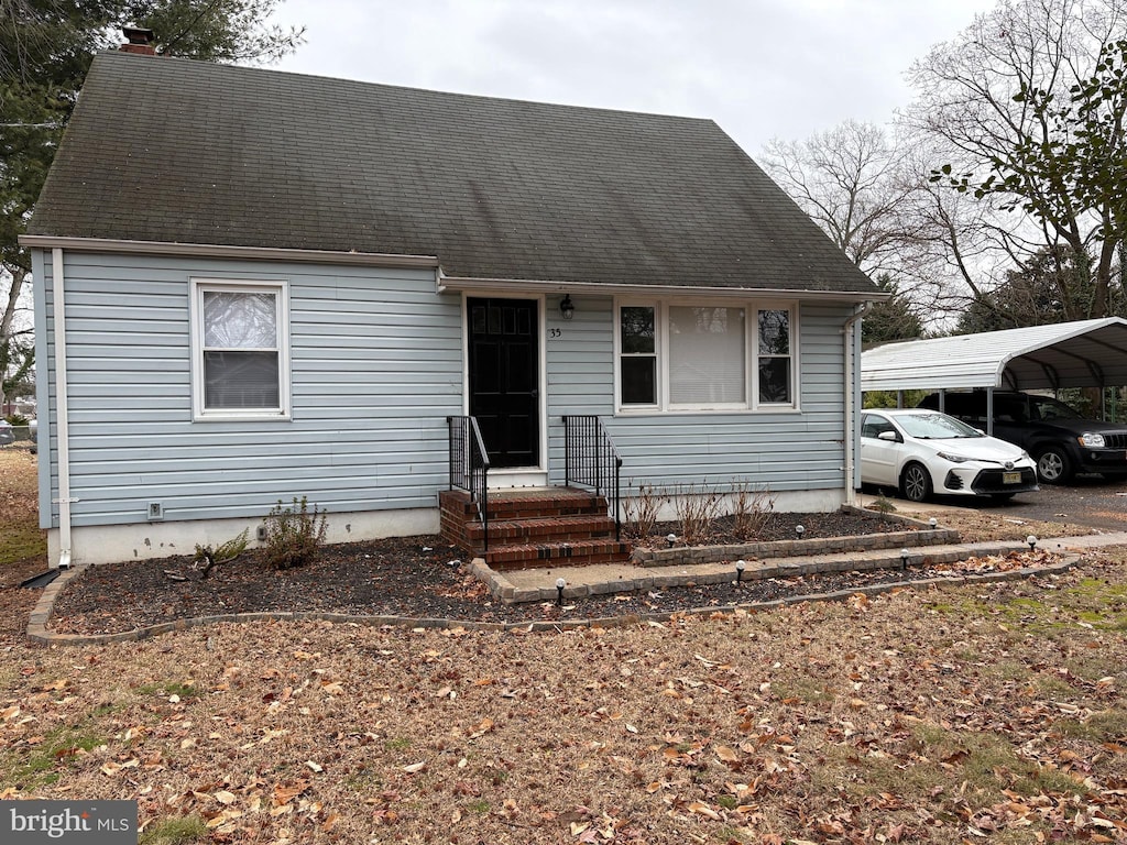 view of front of home with a carport