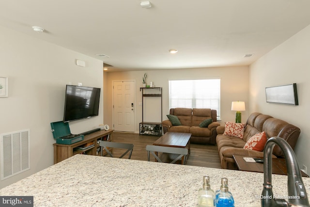 living room featuring dark hardwood / wood-style floors