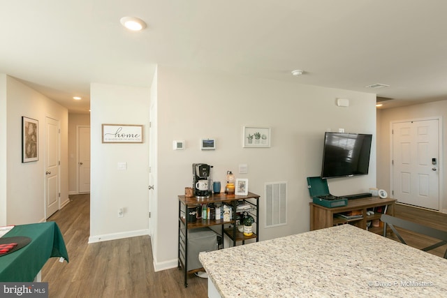 interior space with hardwood / wood-style flooring