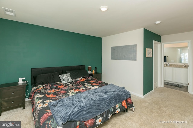 carpeted bedroom with ensuite bathroom