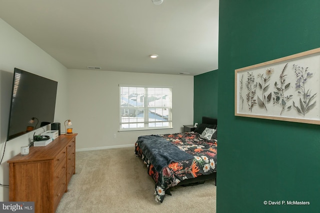 bedroom featuring light carpet