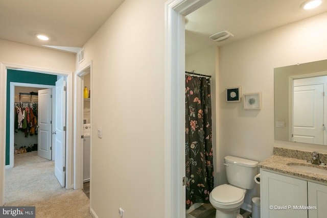 bathroom with toilet and vanity