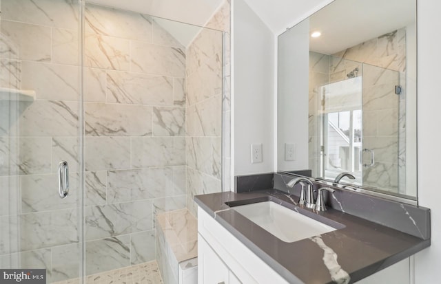 bathroom with vanity and a shower with shower door