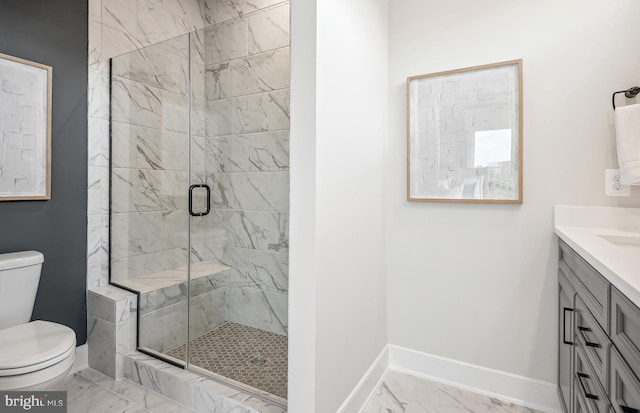 bathroom featuring walk in shower, vanity, and toilet