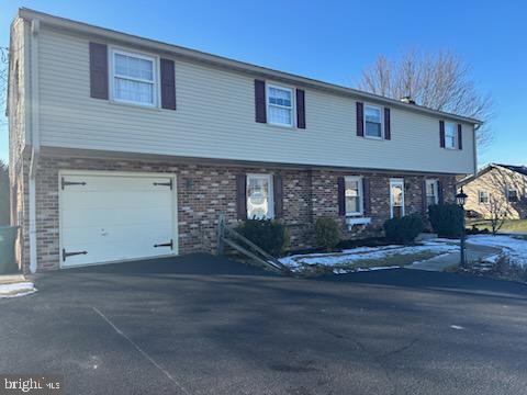 front of property with a garage