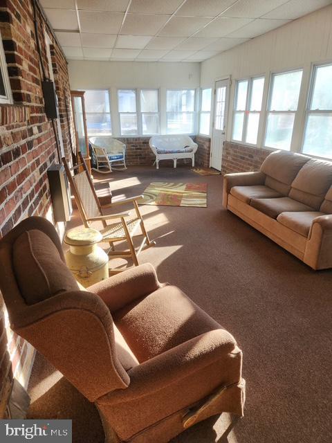 sunroom / solarium with a drop ceiling