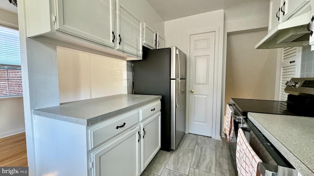 kitchen with white cabinetry and appliances with stainless steel finishes