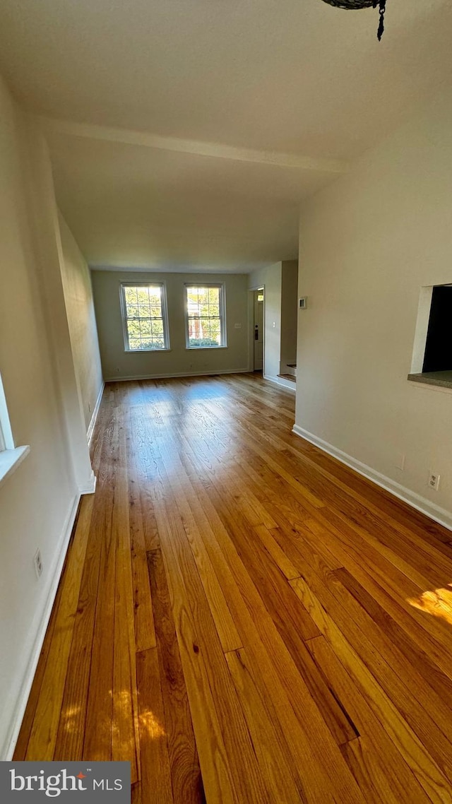 unfurnished living room with hardwood / wood-style flooring