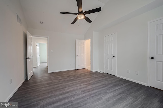 unfurnished bedroom featuring ceiling fan, dark hardwood / wood-style flooring, and high vaulted ceiling