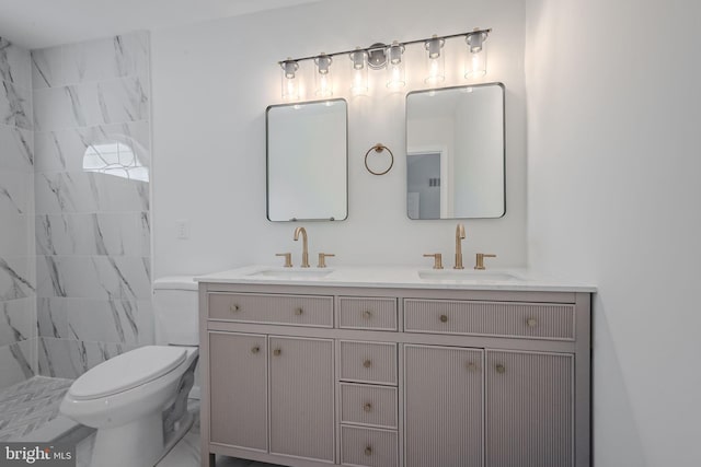 bathroom with toilet and vanity