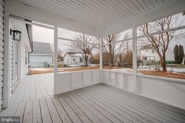 unfurnished sunroom featuring plenty of natural light