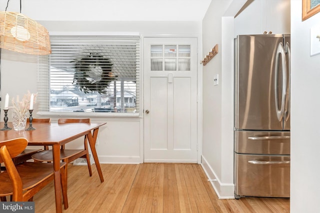 dining area with light wood-type flooring