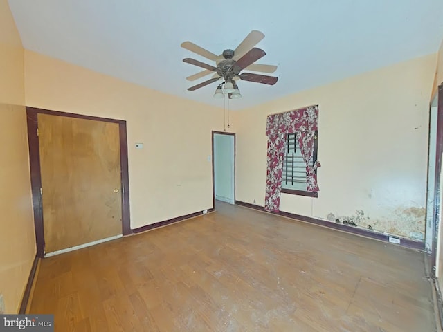 unfurnished bedroom featuring hardwood / wood-style flooring and ceiling fan