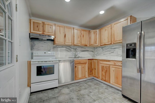 kitchen with stainless steel appliances, sink, light brown cabinets, and backsplash