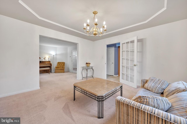 carpeted living room featuring a raised ceiling, french doors, and a notable chandelier