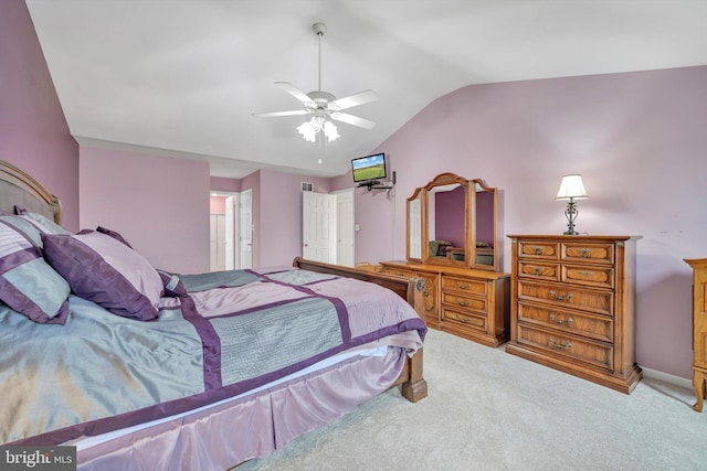 bedroom with ceiling fan, lofted ceiling, and carpet floors