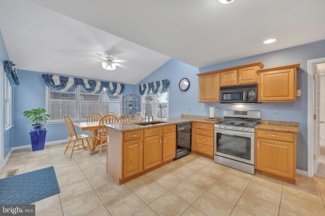 kitchen with light tile patterned floors, kitchen peninsula, stainless steel range with gas cooktop, ceiling fan, and sink