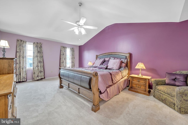 carpeted bedroom featuring ceiling fan and vaulted ceiling