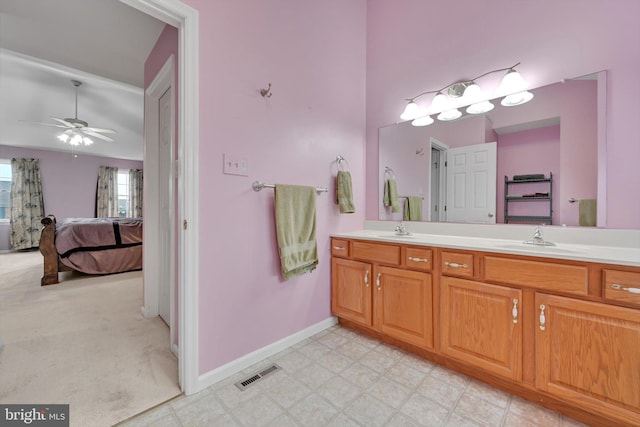 bathroom with ceiling fan and vanity