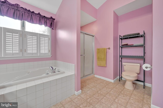 bathroom with toilet and separate shower and tub