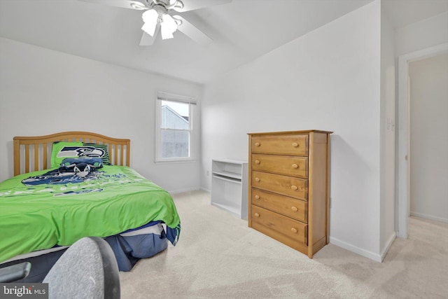 bedroom featuring ceiling fan and light colored carpet