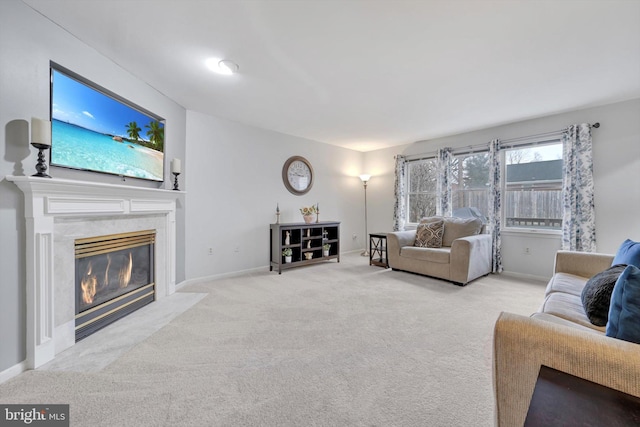 living room featuring light carpet and a fireplace