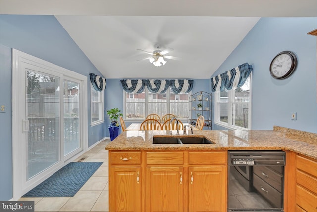 kitchen featuring vaulted ceiling, light tile patterned floors, black dishwasher, and kitchen peninsula