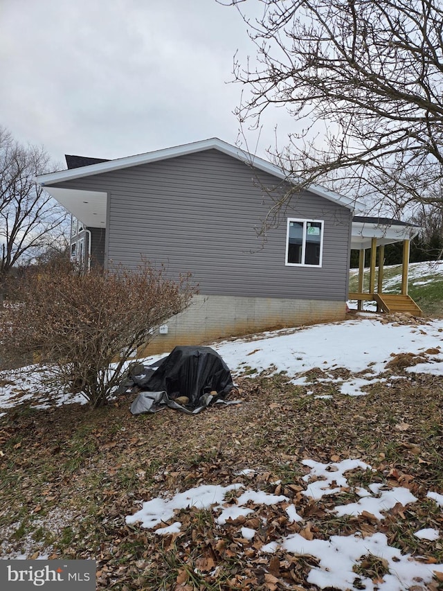 view of snow covered property