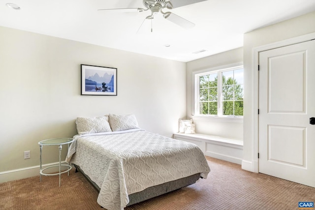 bedroom with ceiling fan and carpet flooring