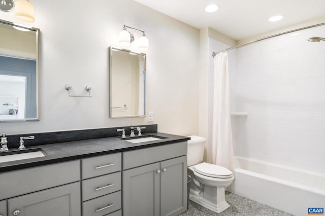 full bathroom with toilet, vanity, and shower / bathtub combination with curtain