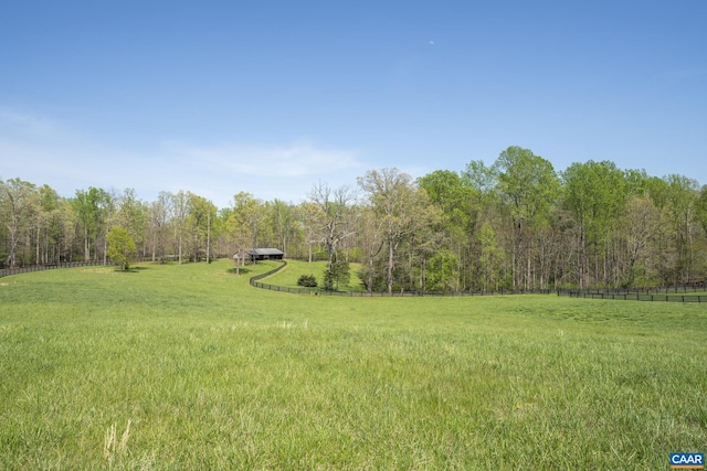 view of yard with a rural view