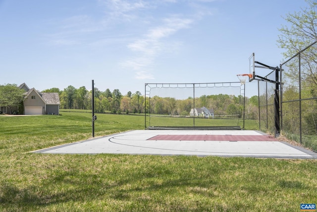 view of sport court featuring a yard