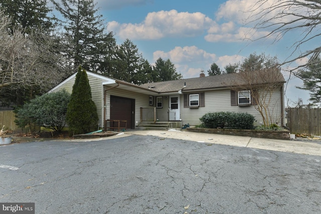 single story home with a garage