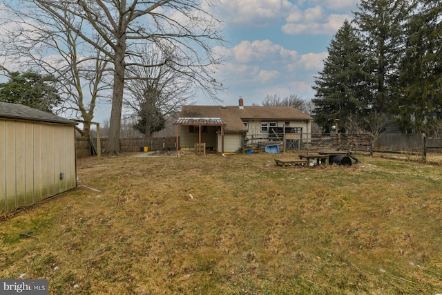 back of property featuring a lawn