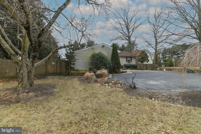 view of home's exterior with a lawn